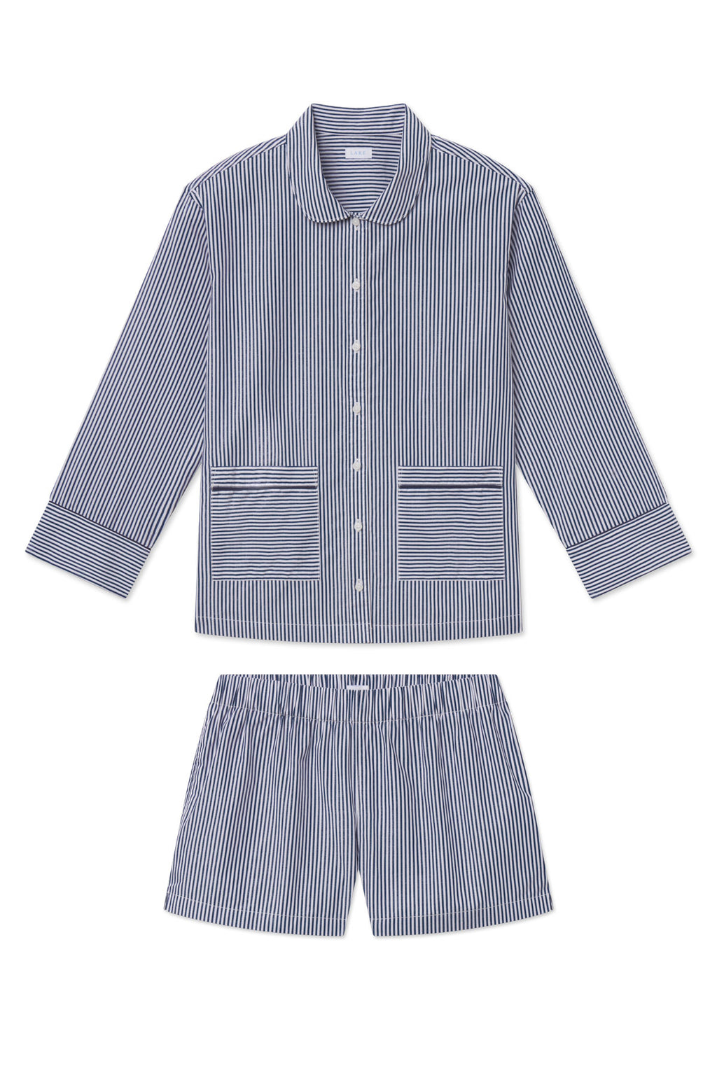 Navy and white striped poplin pajama set with piped collar, patch pockets, and matching shorts.