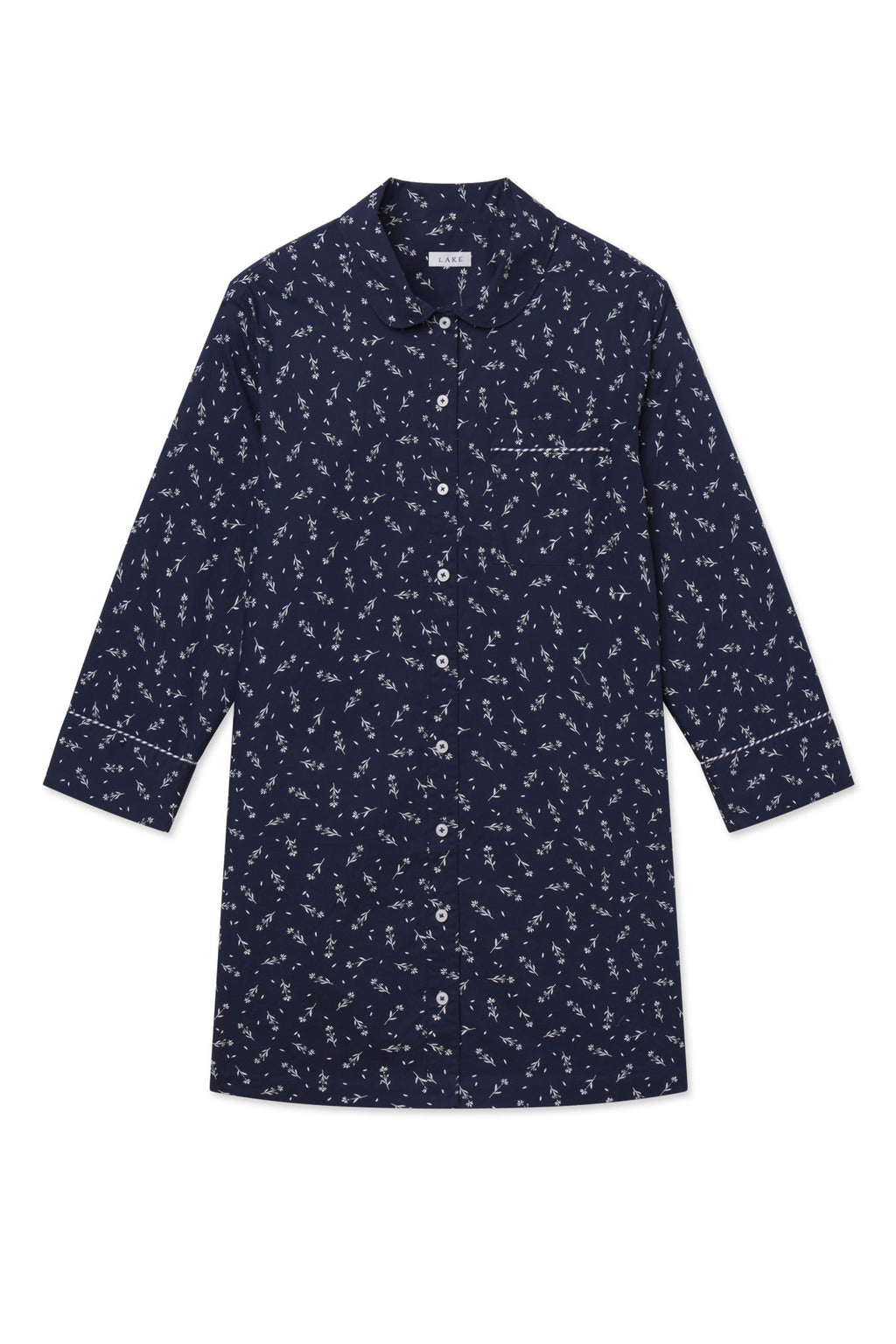 Navy nightgown with small floral print, button front, three-quarter sleeves, and piped trim at chest and cuffs.