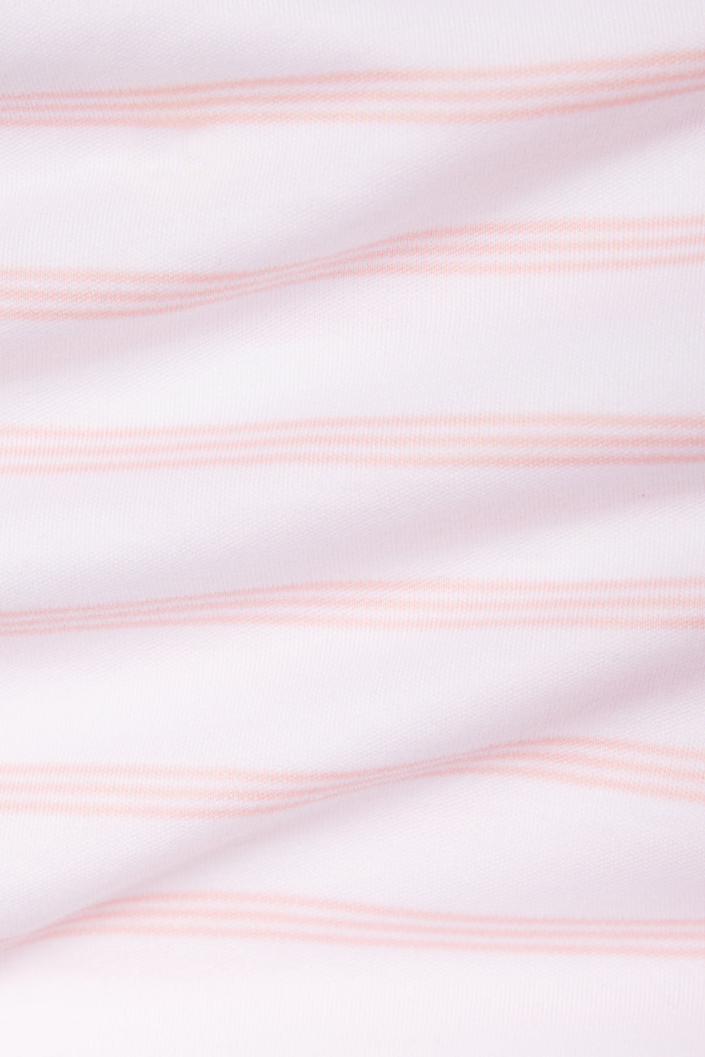 Close-up of the Kids Shorts Set in English Rose Triple Stripe, featuring thin, light pink horizontal stripes on soft Pima cotton. Gentle folds highlight its textured look—ideal comfort for kids.