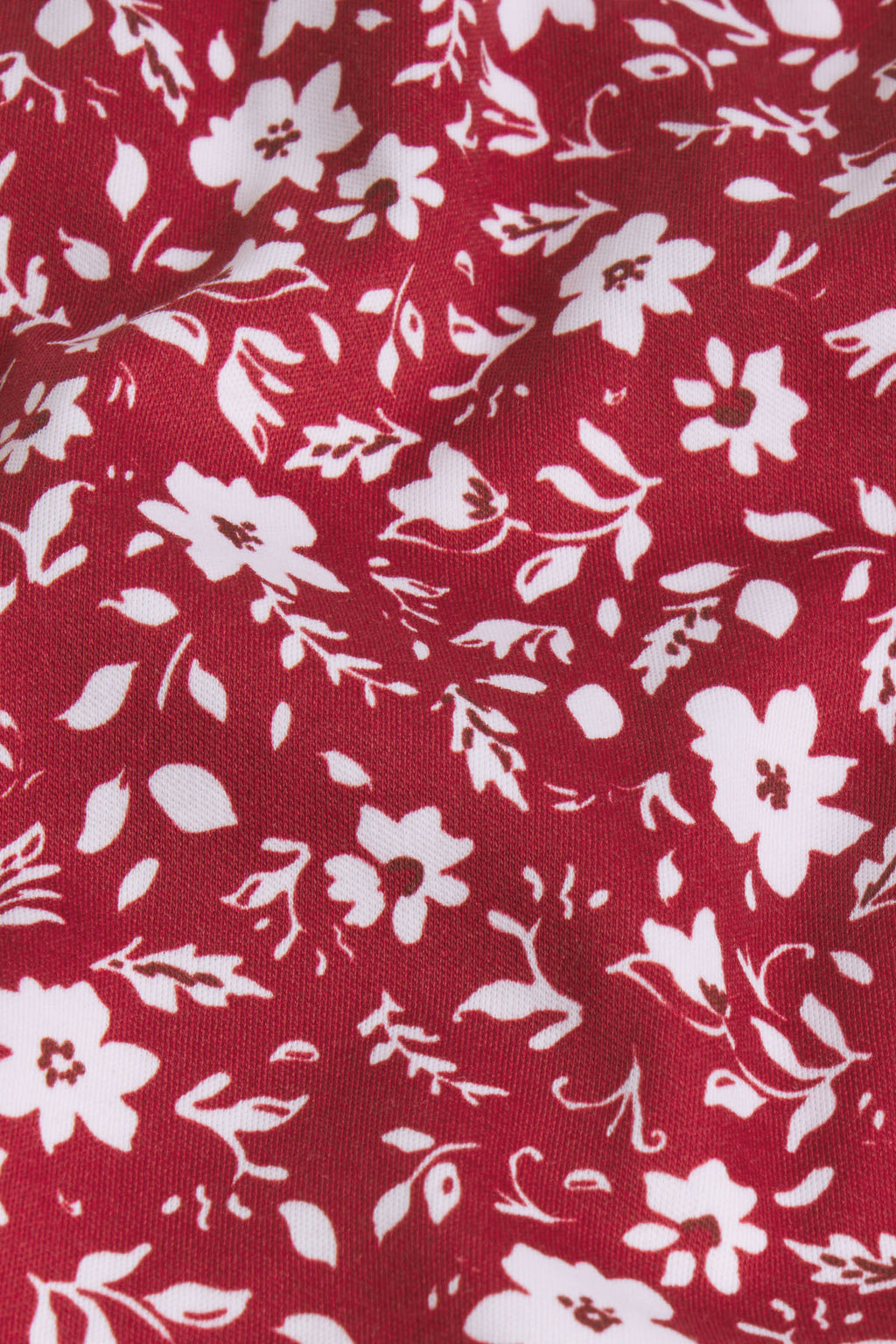 Garnet red Pima cotton fabric with white and burgundy floral and leaf print pattern.