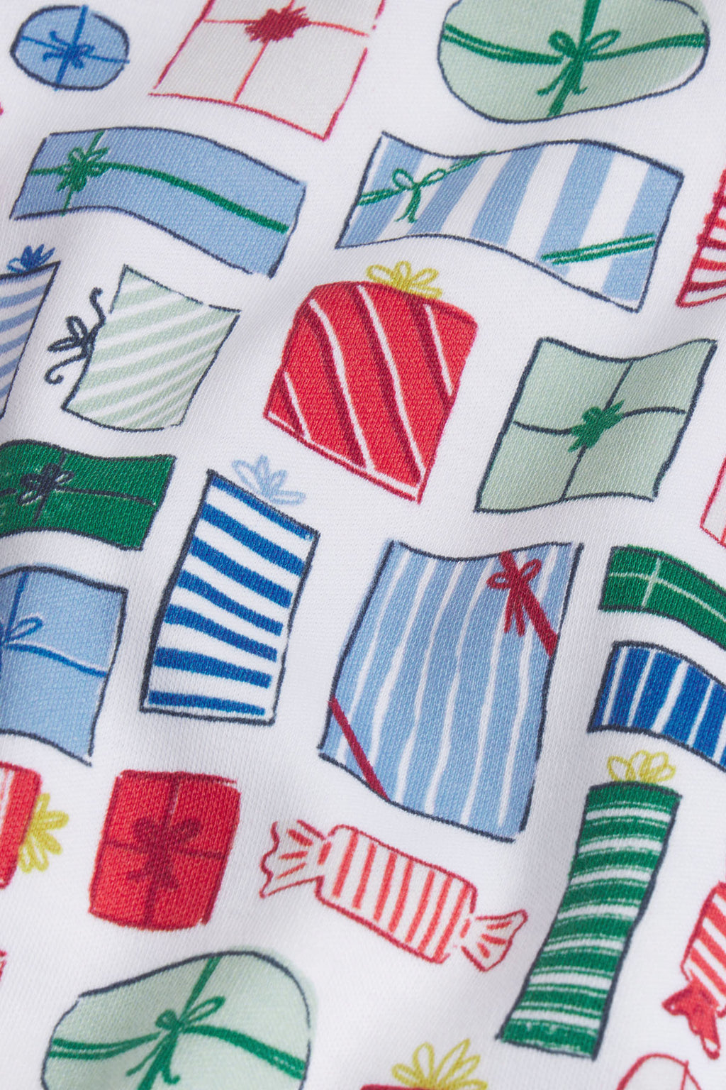 White fabric with colorful gift box and wrapped present print in red, blue, and green.