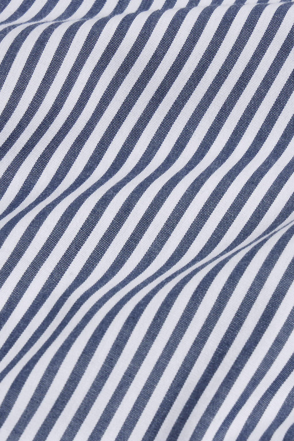 Navy and white diagonal striped poplin fabric with visible weave texture.