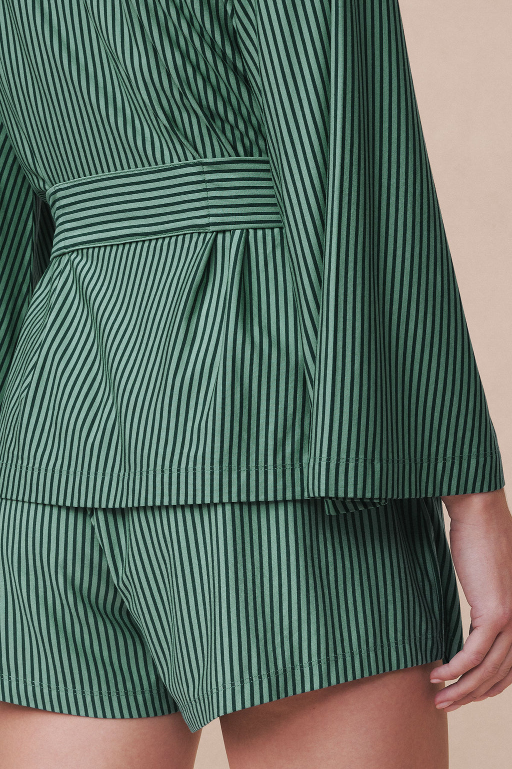 Green and white vertical striped kimono shorts with matching tie waist detail.