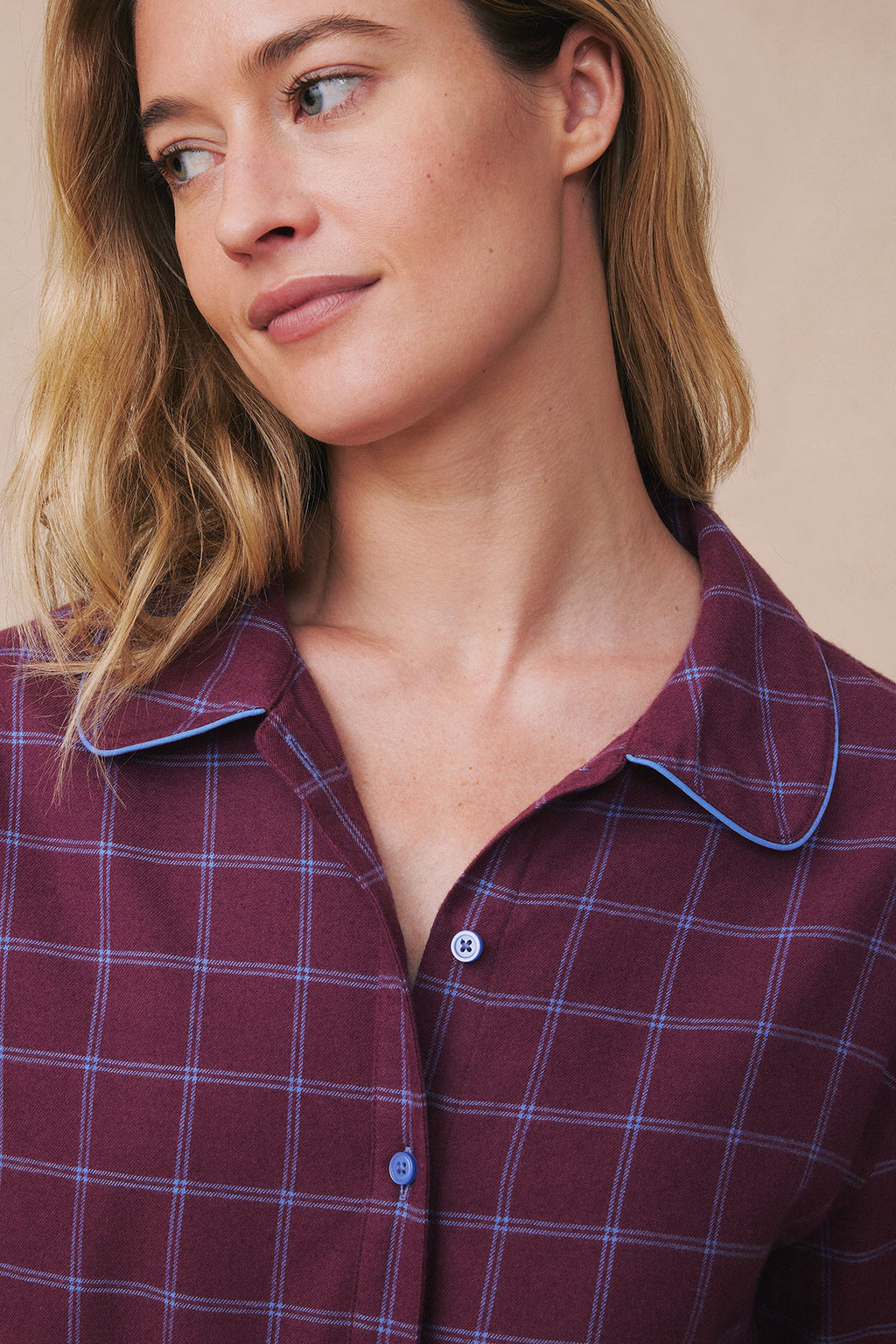 Burgundy windowpane flannel pajama top with blue and white plaid pattern, collar, and button front.