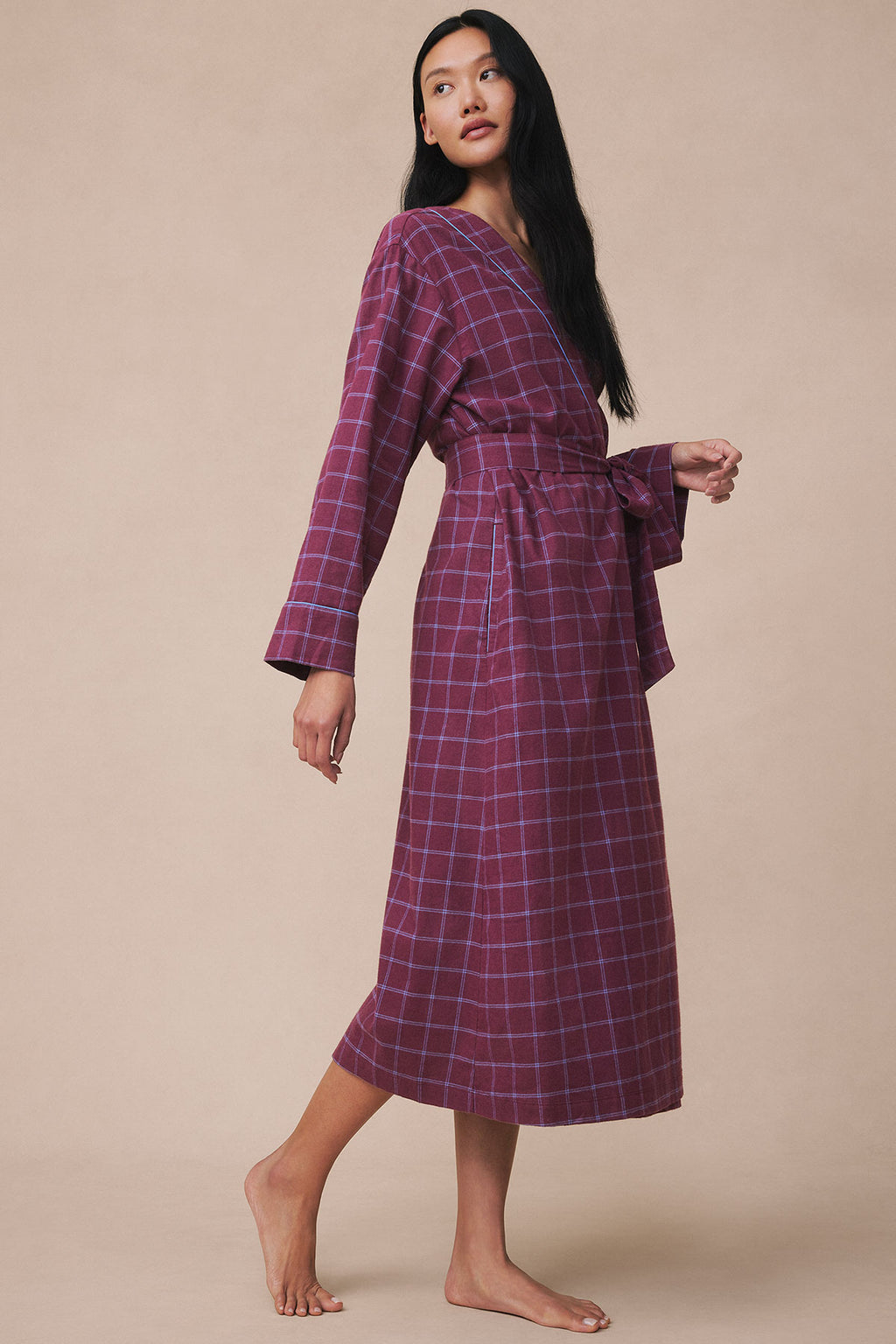 Purple and blue windowpane plaid flannel robe with long sleeves and wrap-front closure worn by a model.