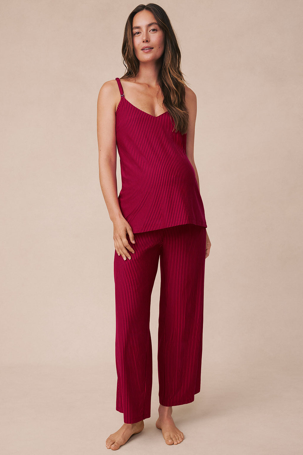 Burgundy ribbed camisole and wide-leg pants set with vertical stripe pattern on neutral background.