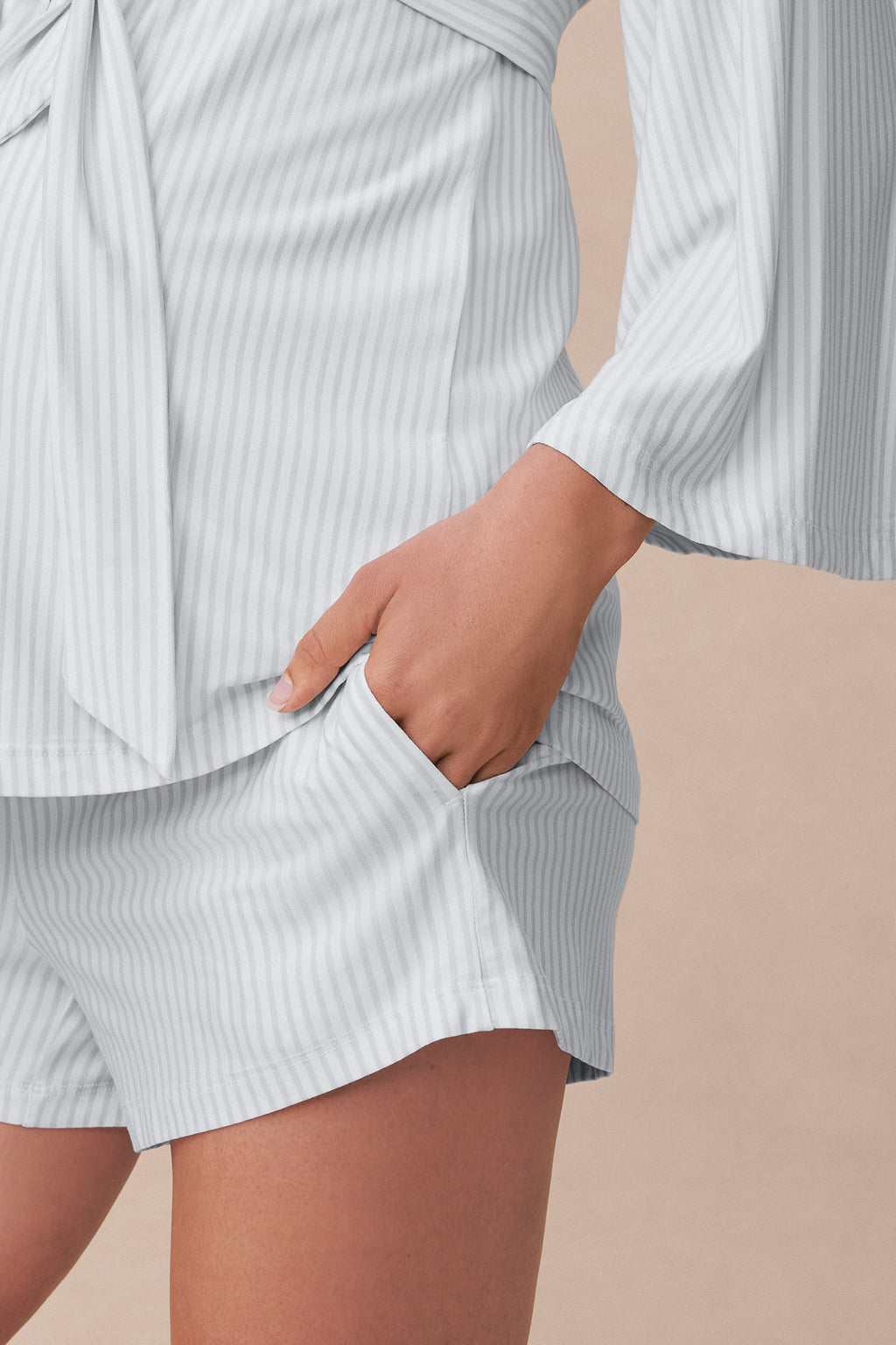 Gray ribbed kimono with matching shorts set shown on model with hand in pocket.