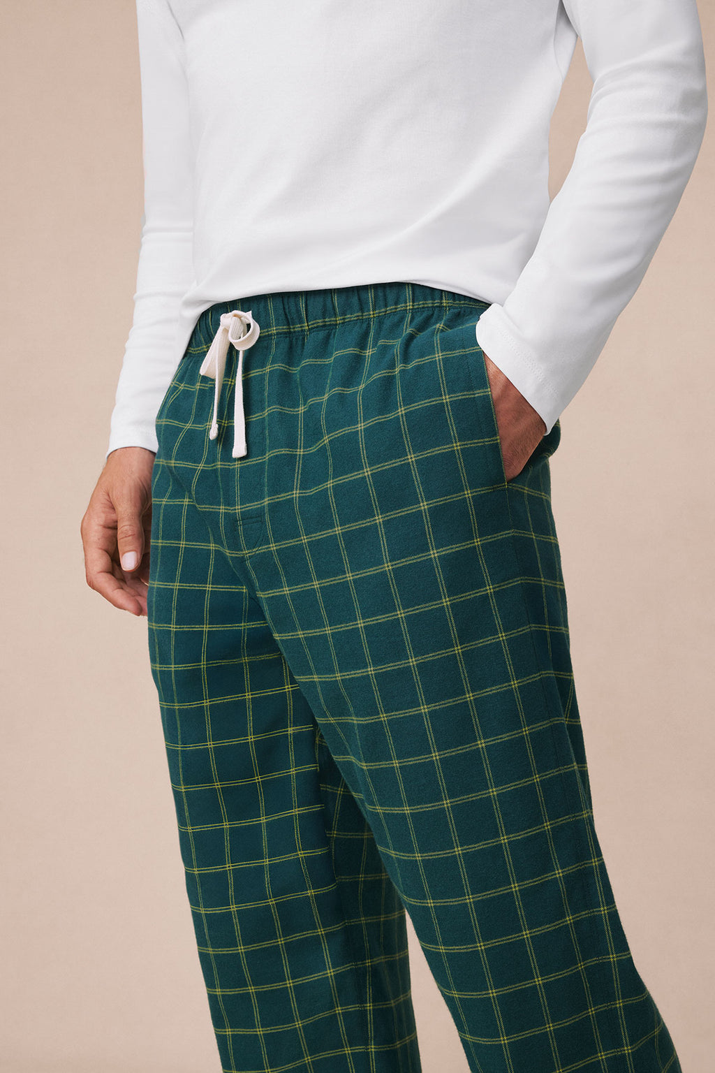 Dark teal flannel pajama pants with yellow windowpane plaid pattern and drawstring waist.