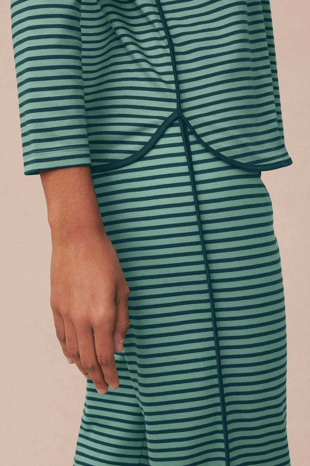 Long-sleeve striped pajama set in dark teal and light blue horizontal stripes with drawstring waist detail.