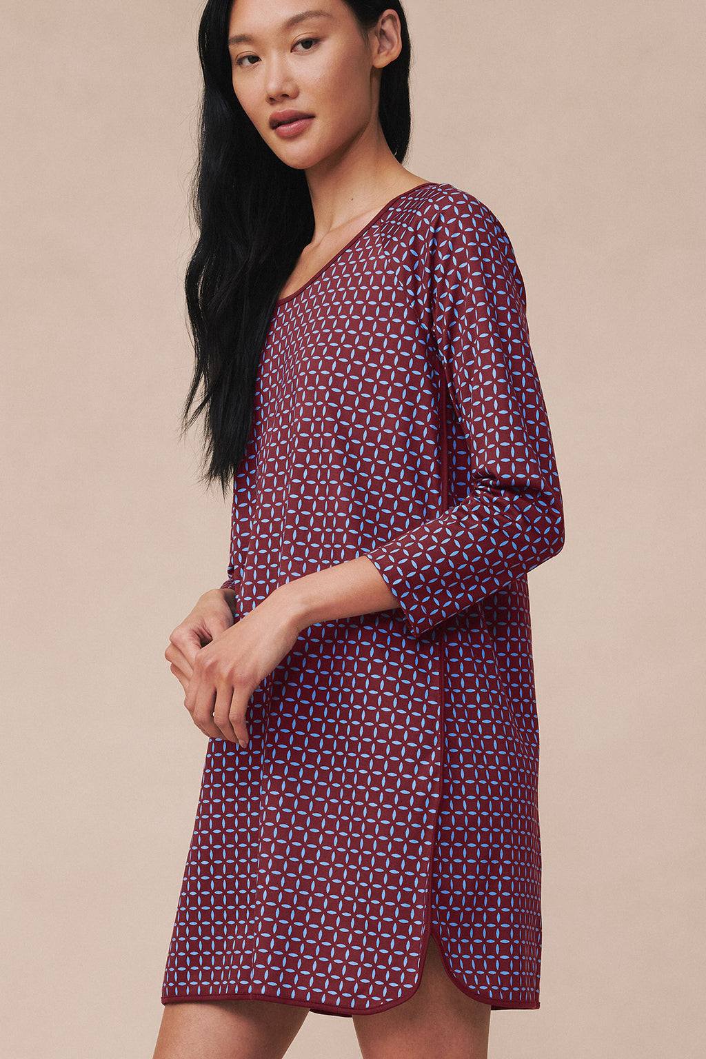 Burgundy nightgown with blue geometric starburst pattern and three-quarter length sleeves.