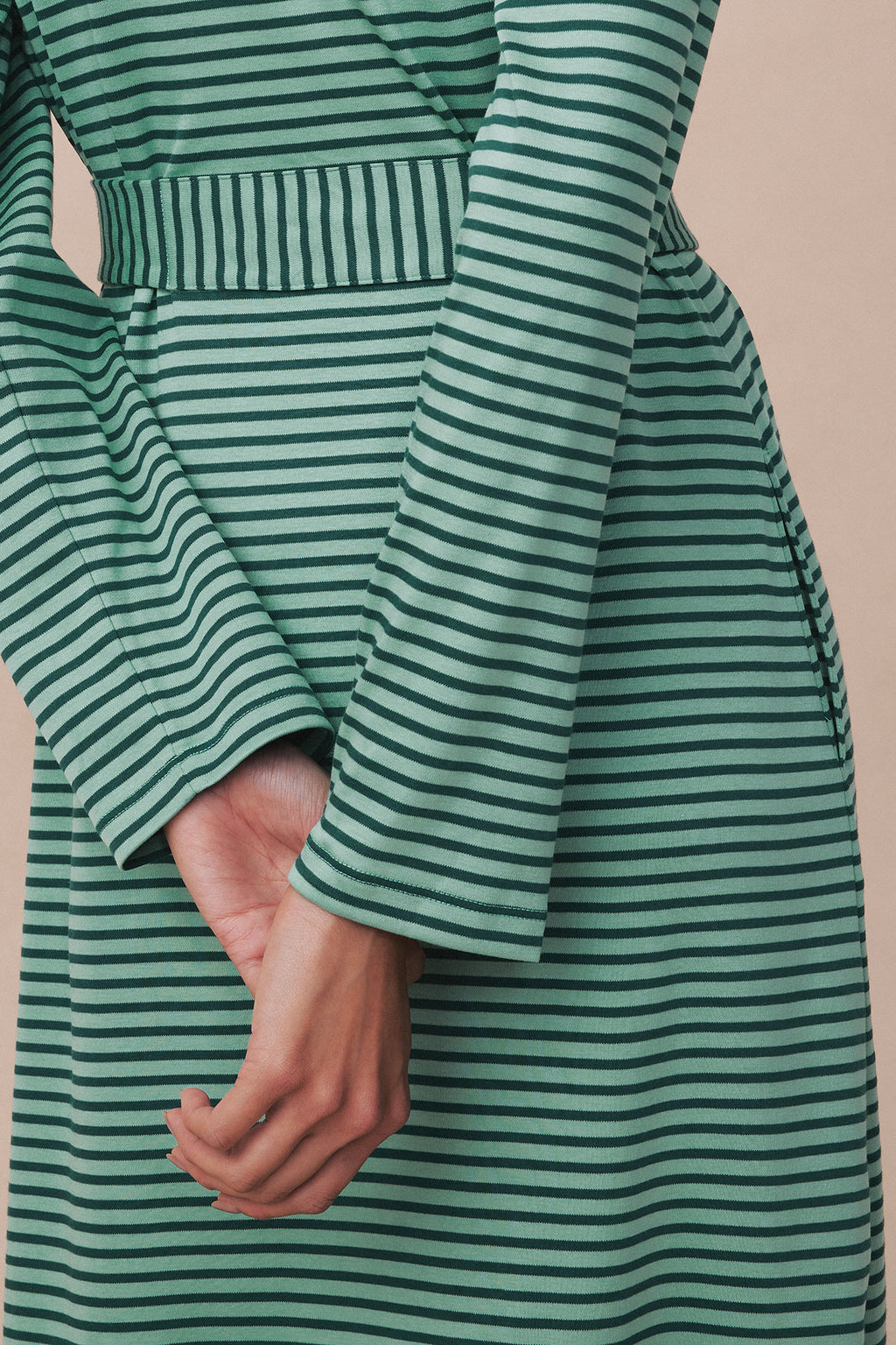 Green and white striped Pima robe with long sleeves, waist tie, and pocket detail.