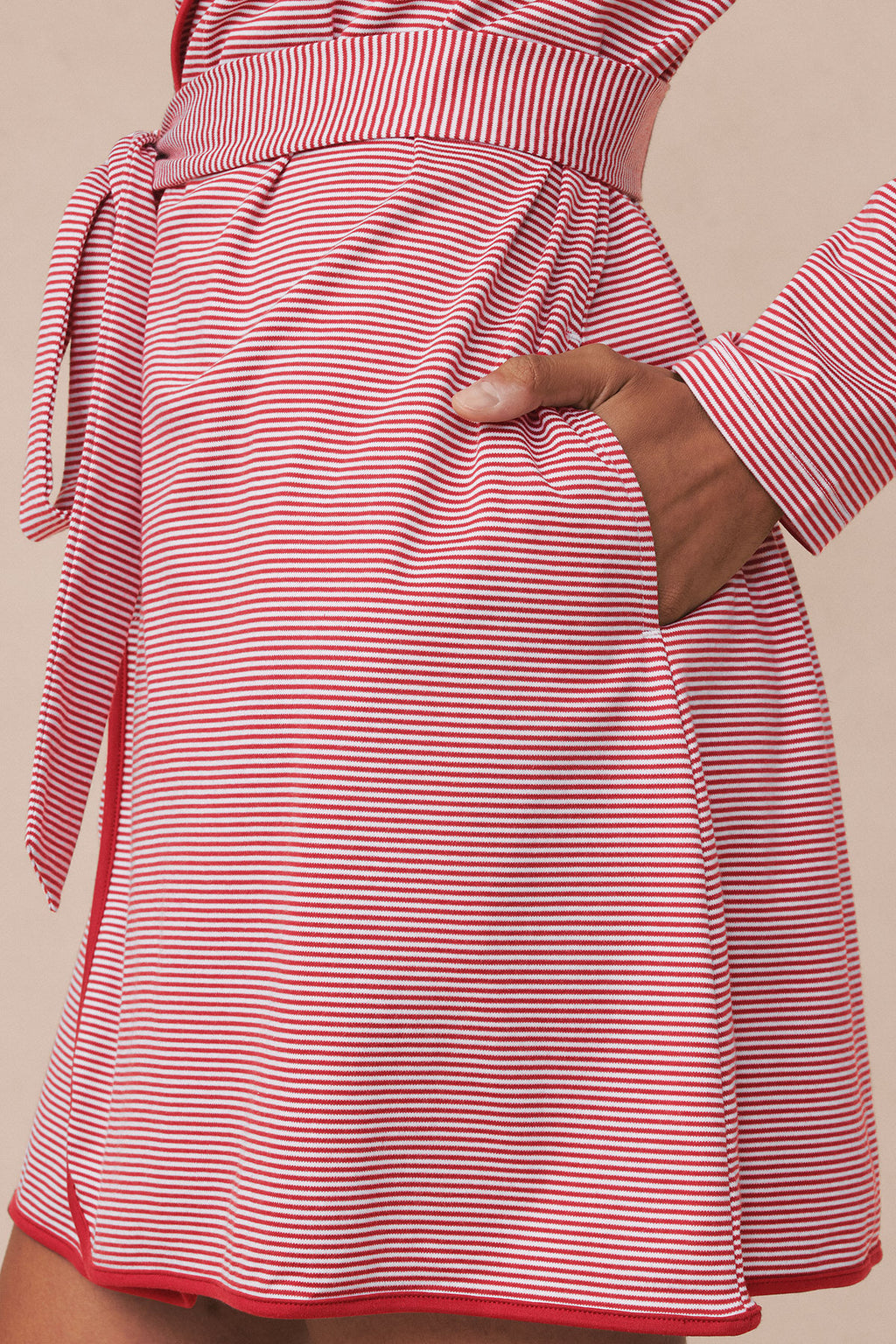 Red and white striped short robe with three-quarter sleeves, side pockets, and tie waist closure.