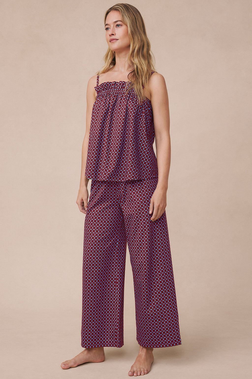 Burgundy and blue geometric patterned sleeveless camisole and wide-leg pants set with ruffled neckline.