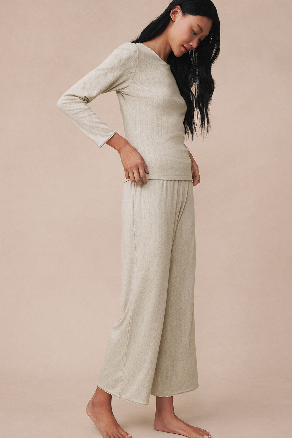 Oat heather pointelle long-sleeve top and wide-leg pants set on model shown from side.