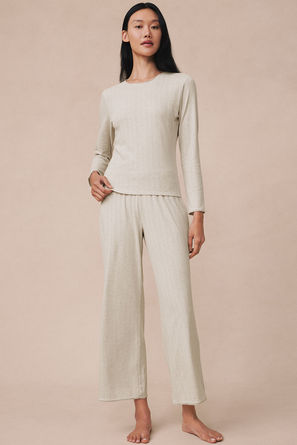 Woman wearing oat heather pointelle long-sleeve top and matching wide-leg pants.