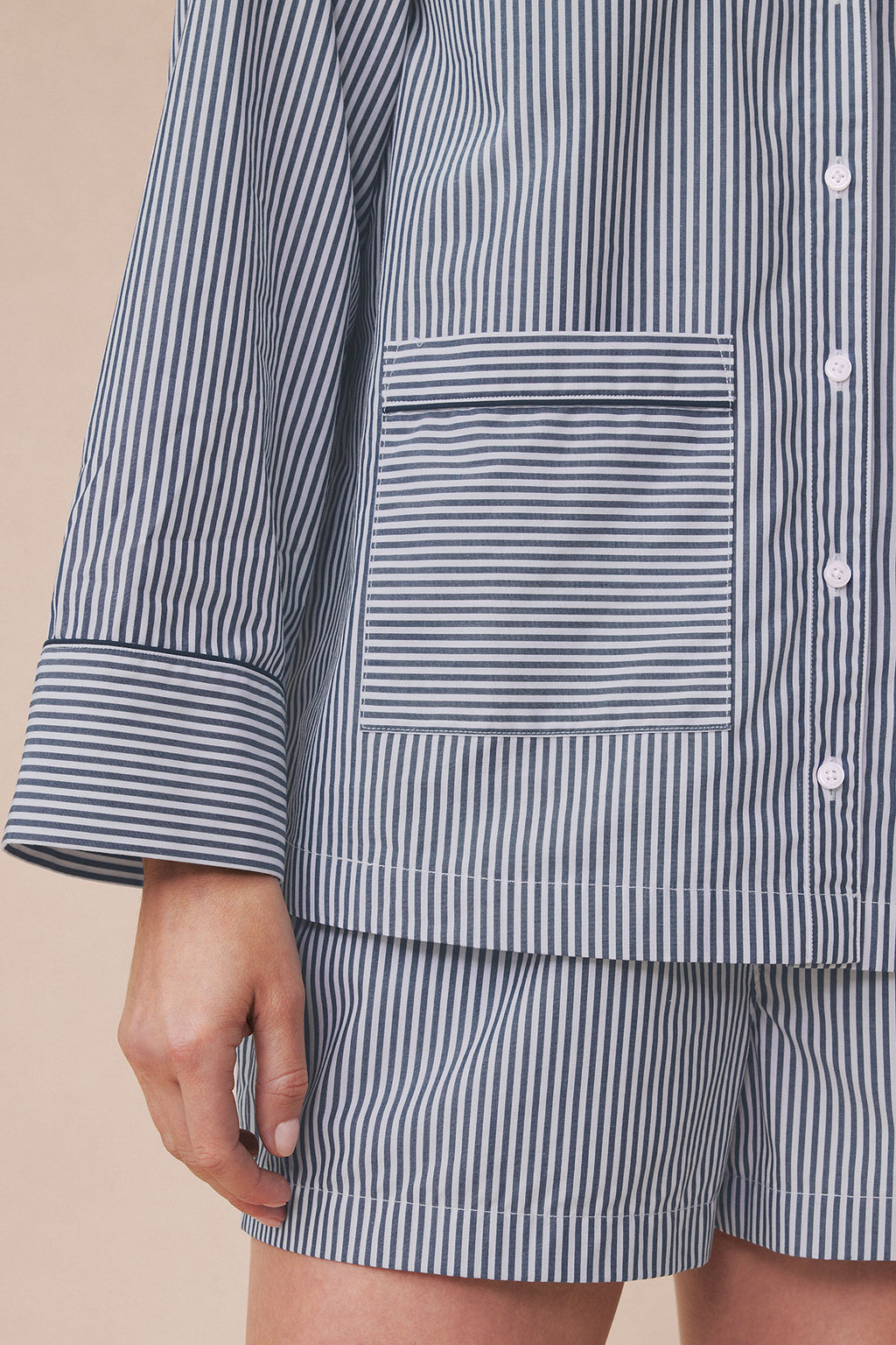 Navy and white vertical striped poplin shirt with horizontal striped pocket and piped cuff detail.