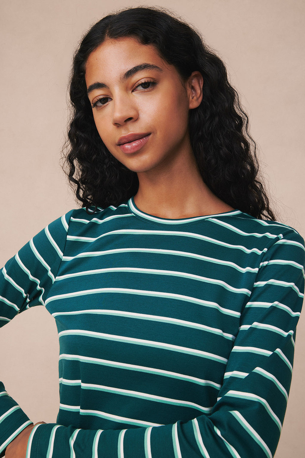 Dark teal and white striped crew neck long-sleeve top with horizontal stripes throughout.