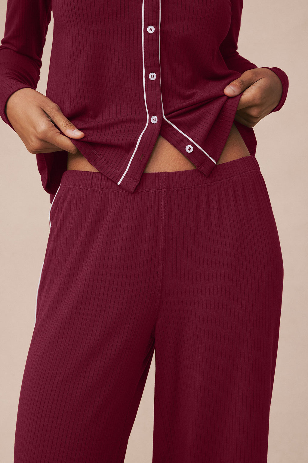 Burgundy ribbed button-front top and wide-leg pants set with white piping trim.