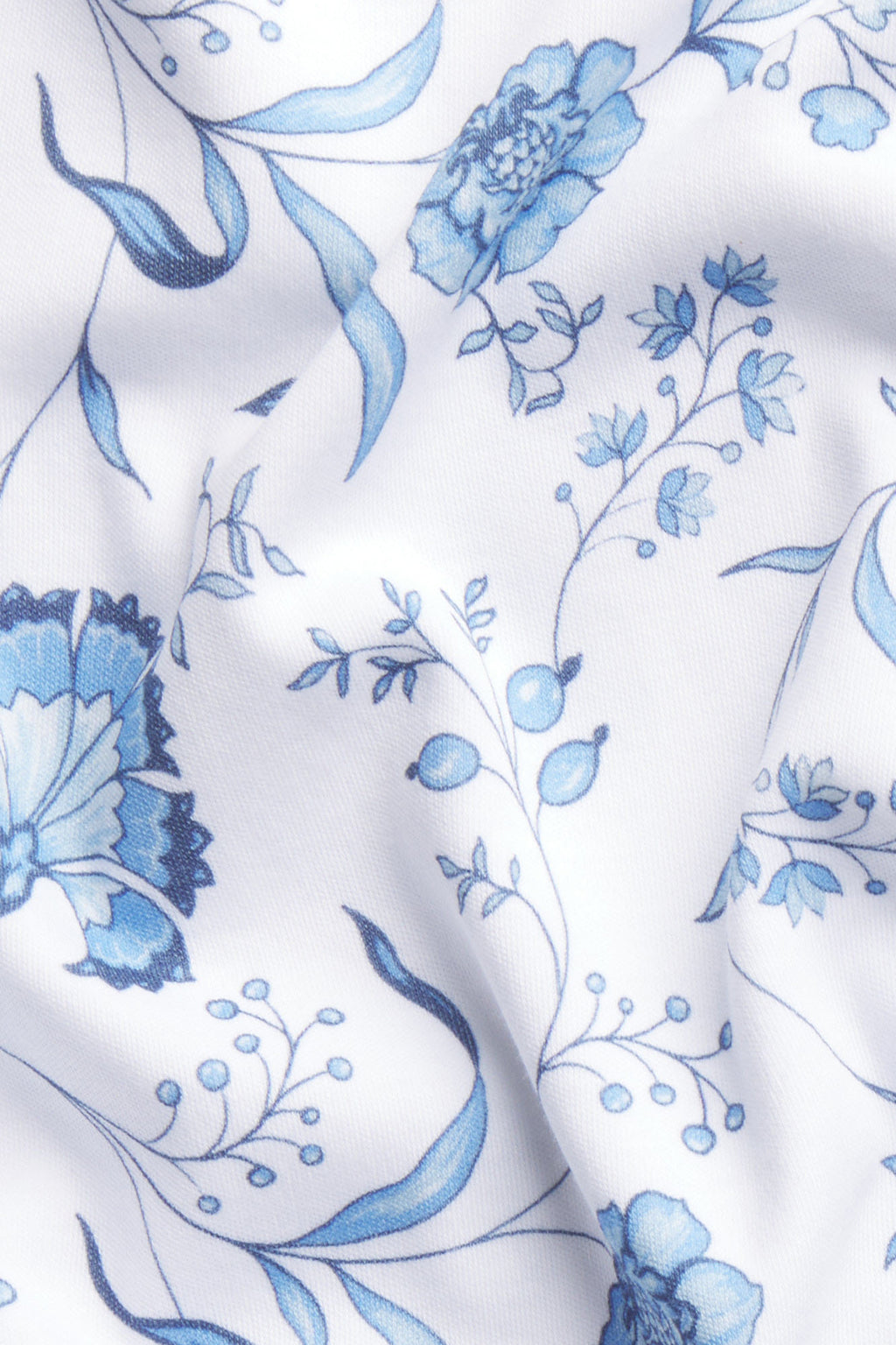 White Pima cotton fabric with blue bell flower and vine print pattern.