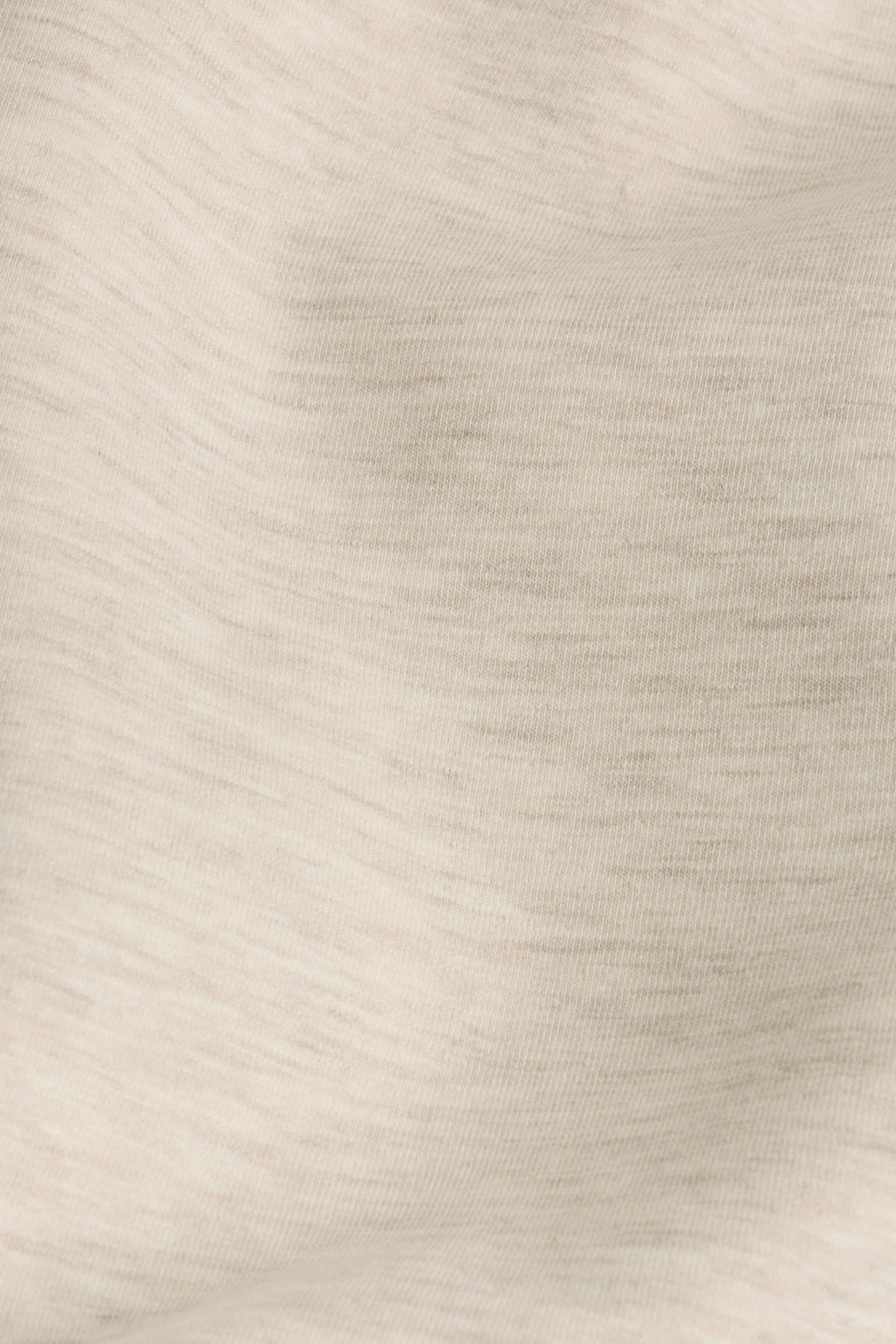 Oat heather ribbed knit fabric with vertical texture detail.