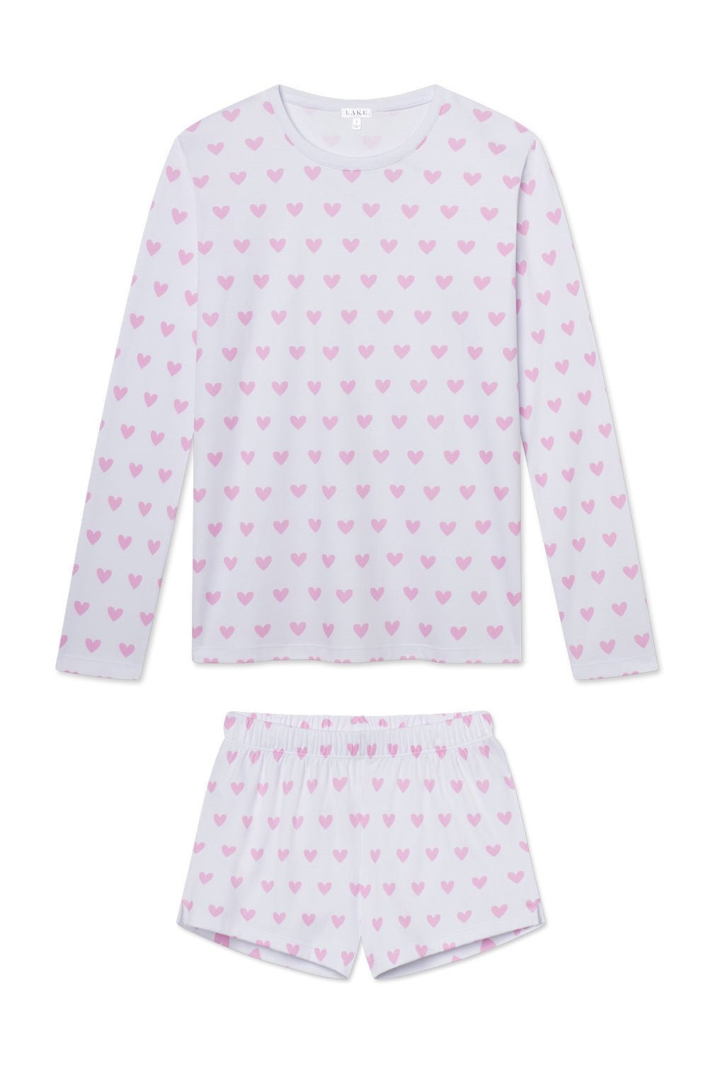 The Pima Crew Long-Short Set in Darling Pink Heart features a white Pima Cotton long-sleeve top and shorts, decorated with an all-over pink heart pattern.
