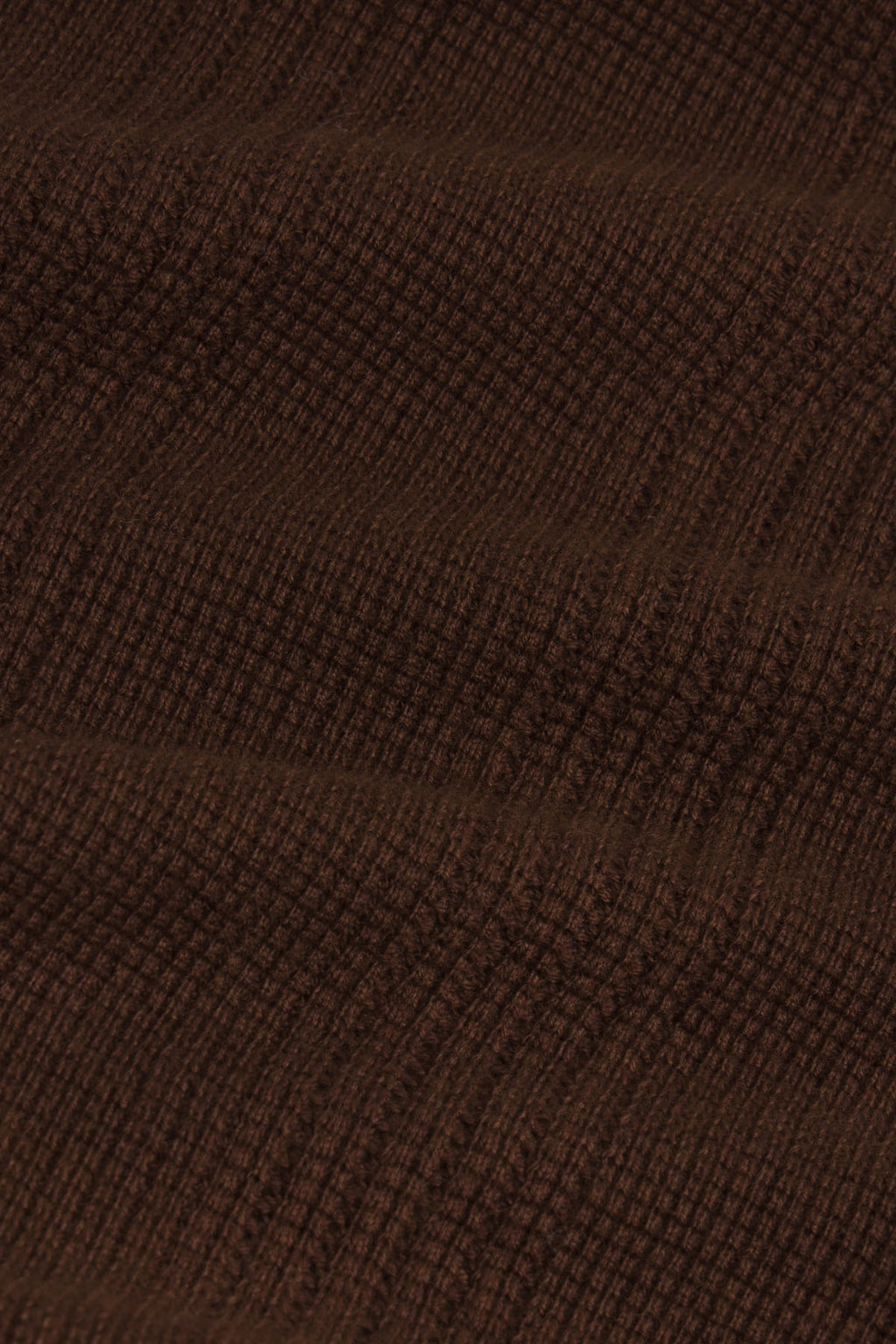 Cocoa brown waffle knit fabric with textured diagonal pattern.