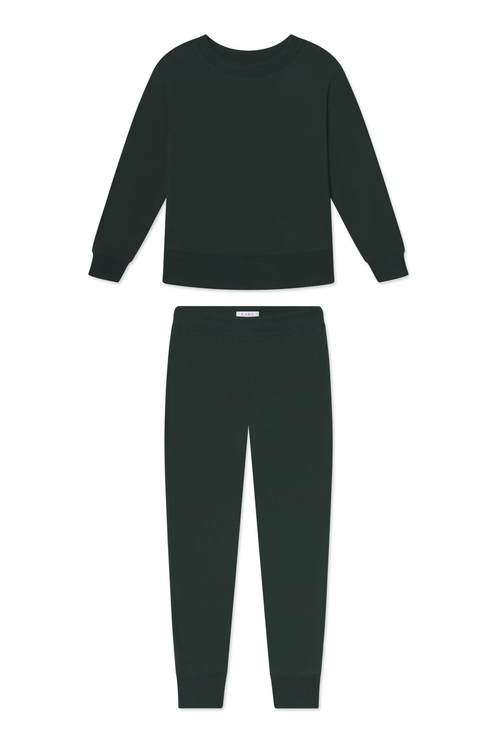 The Relax Jogger Set in Conifer is shown on a white background, featuring a dark green long-sleeve cropped crewneck sweatshirt with ribbed cuffs and jogger pants with an elastic waistband and ribbed ankles.