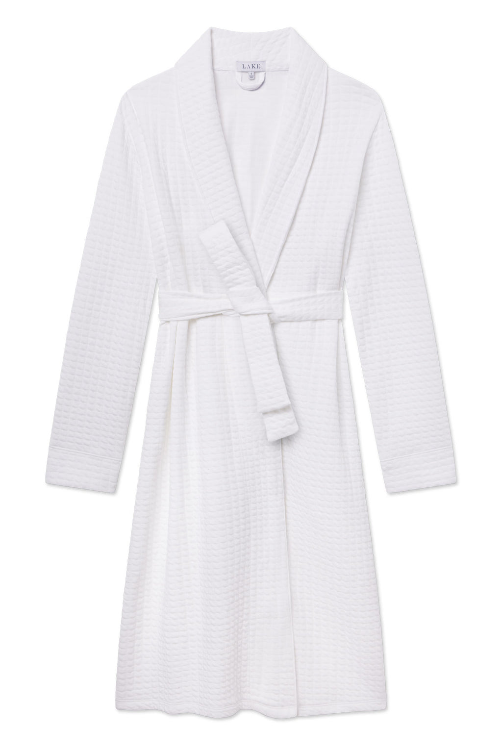 The Jacquard Spa Robe in White is a knee-length, lightweight robe featuring a waffle-textured design, long sleeves, shawl collar, and a matching fabric belt at the waist.