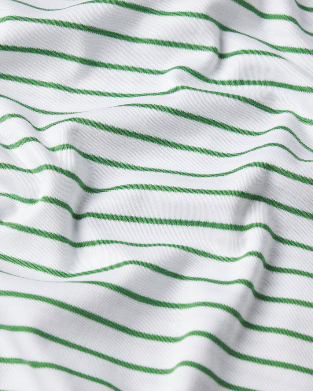 The Pima Short-Long Set in Palm Rowing Stripe features soft, breathable white Pima cotton with evenly spaced horizontal green stripes—ideal for cozy pajamas and creating gentle waves and shadows on the fabric.
