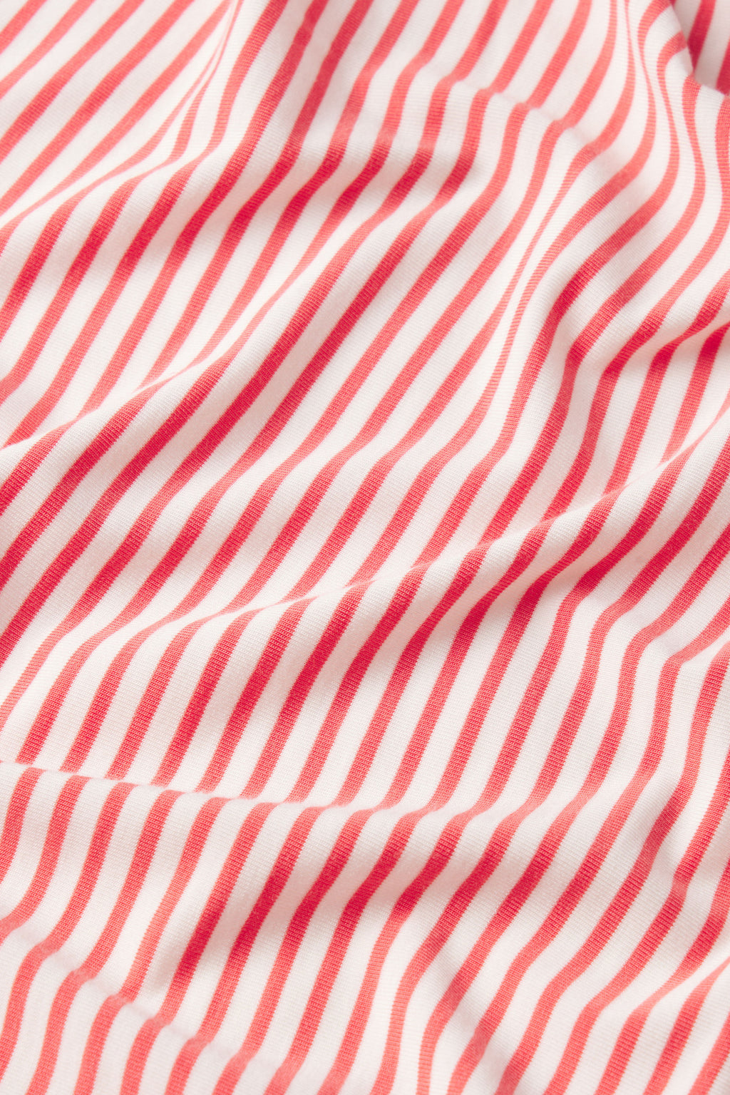 A close-up of the DreamModal Kimono Shorts Bundle in Terrace Pencil Stripe, highlighting the soft red and white striped fabric with visible texture and gentle folds.