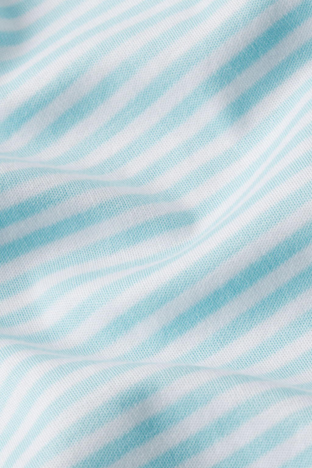 Close-up of the Pima Maternity Shorts Set in Salt Spray Heritage Stripe, showcasing soft folds and smooth textured light blue and white striped fabric—luxurious Pima cotton perfect for comfortable maternity wear.