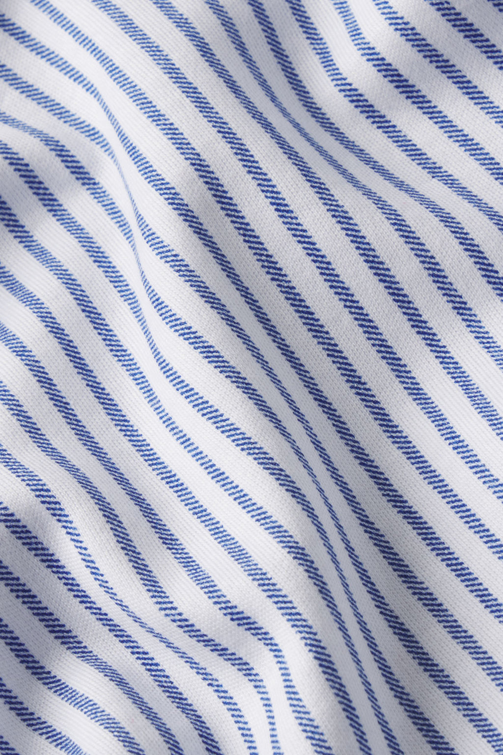 White fabric with diagonal navy compass stripe pattern.