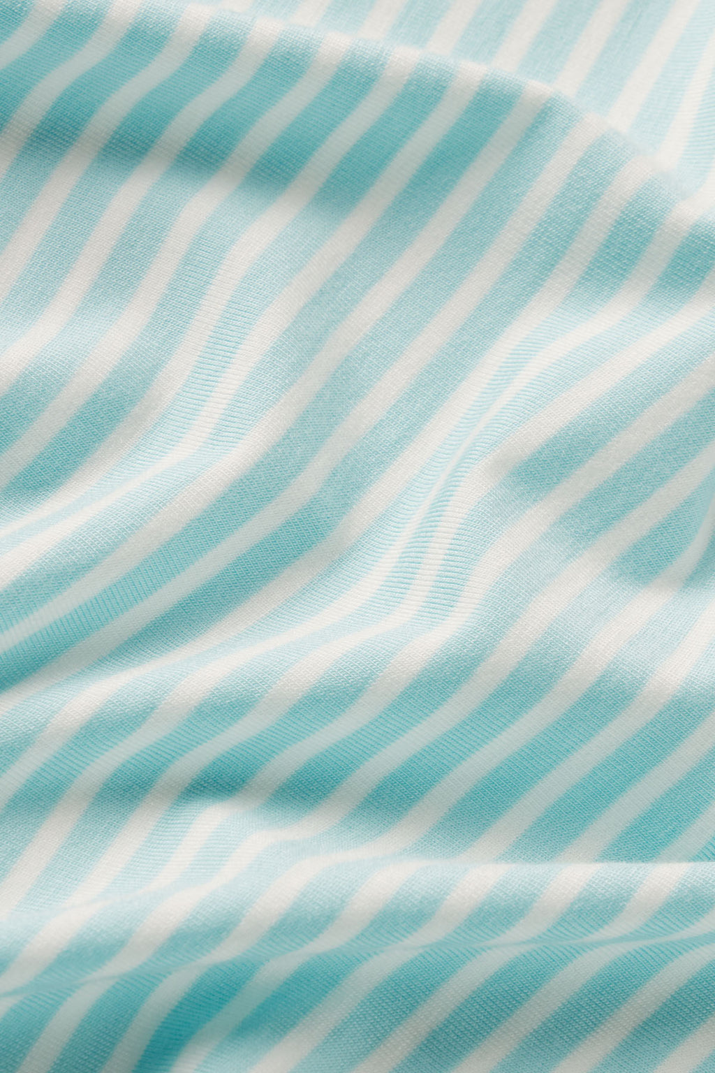 Light blue and white vertical striped DreamModal fabric with textured weave.