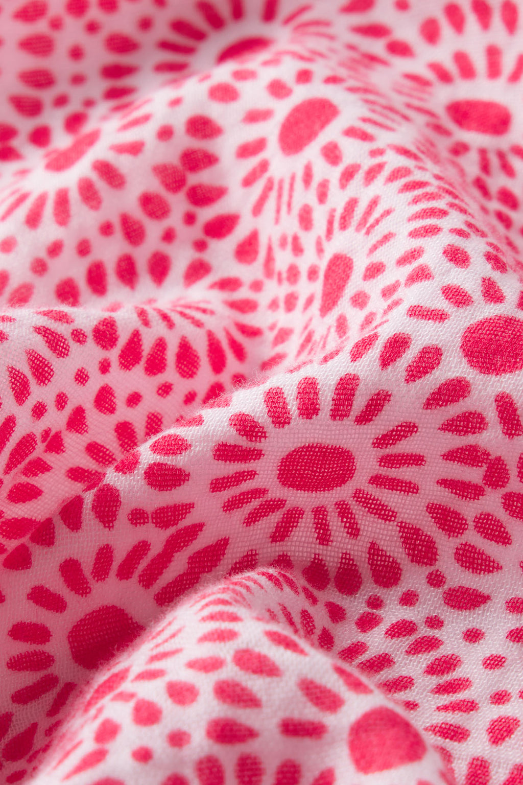Close-up of the Hamptons Nightgown in Bougainvillea Dot Gauze—white textured gauze fabric with a pink dot pattern. The softly wrinkled material adds depth and is ideal for hot sleepers.