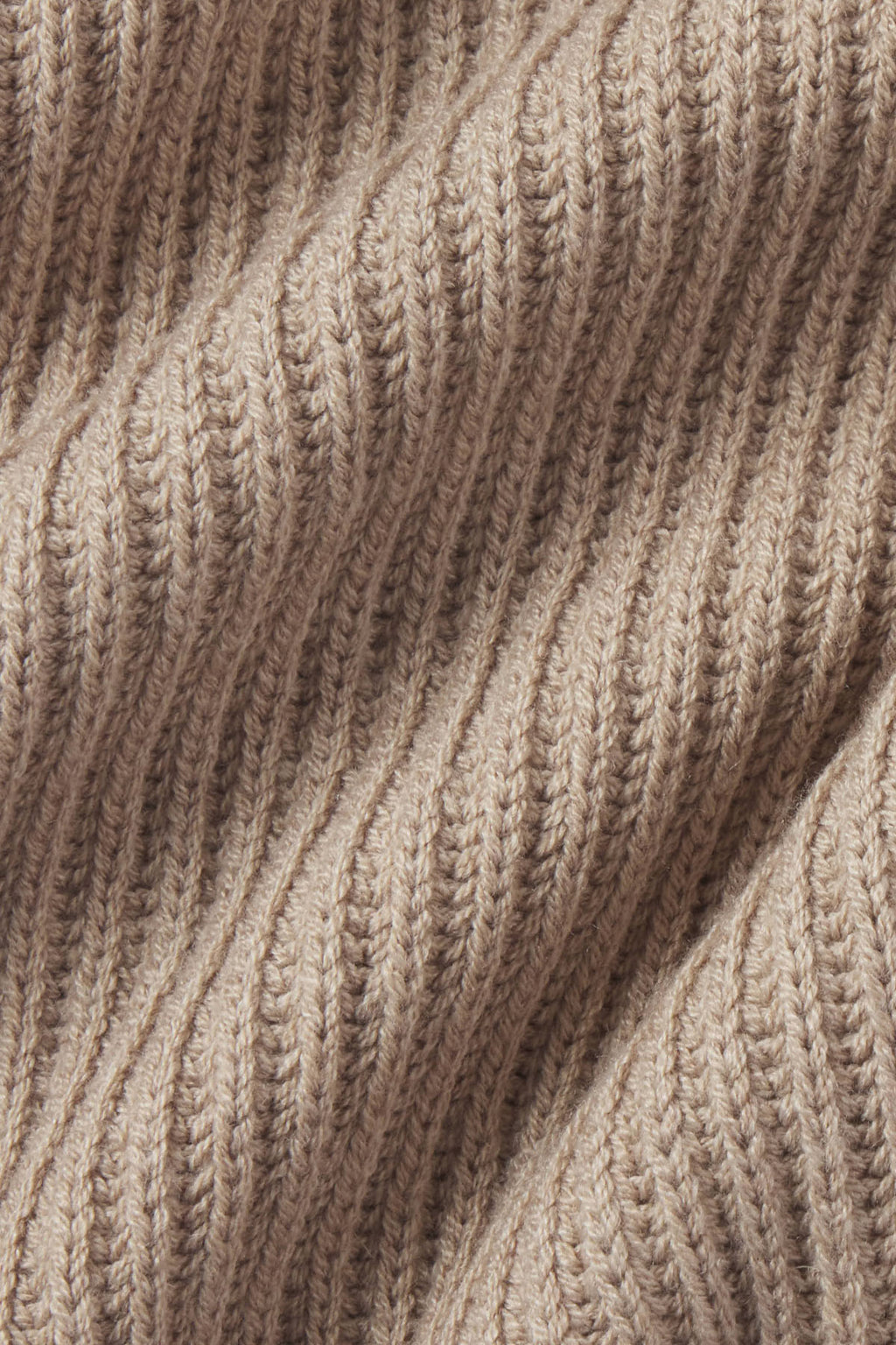 Fawn heather ribbed fabric with vertical knit texture and diagonal fold.