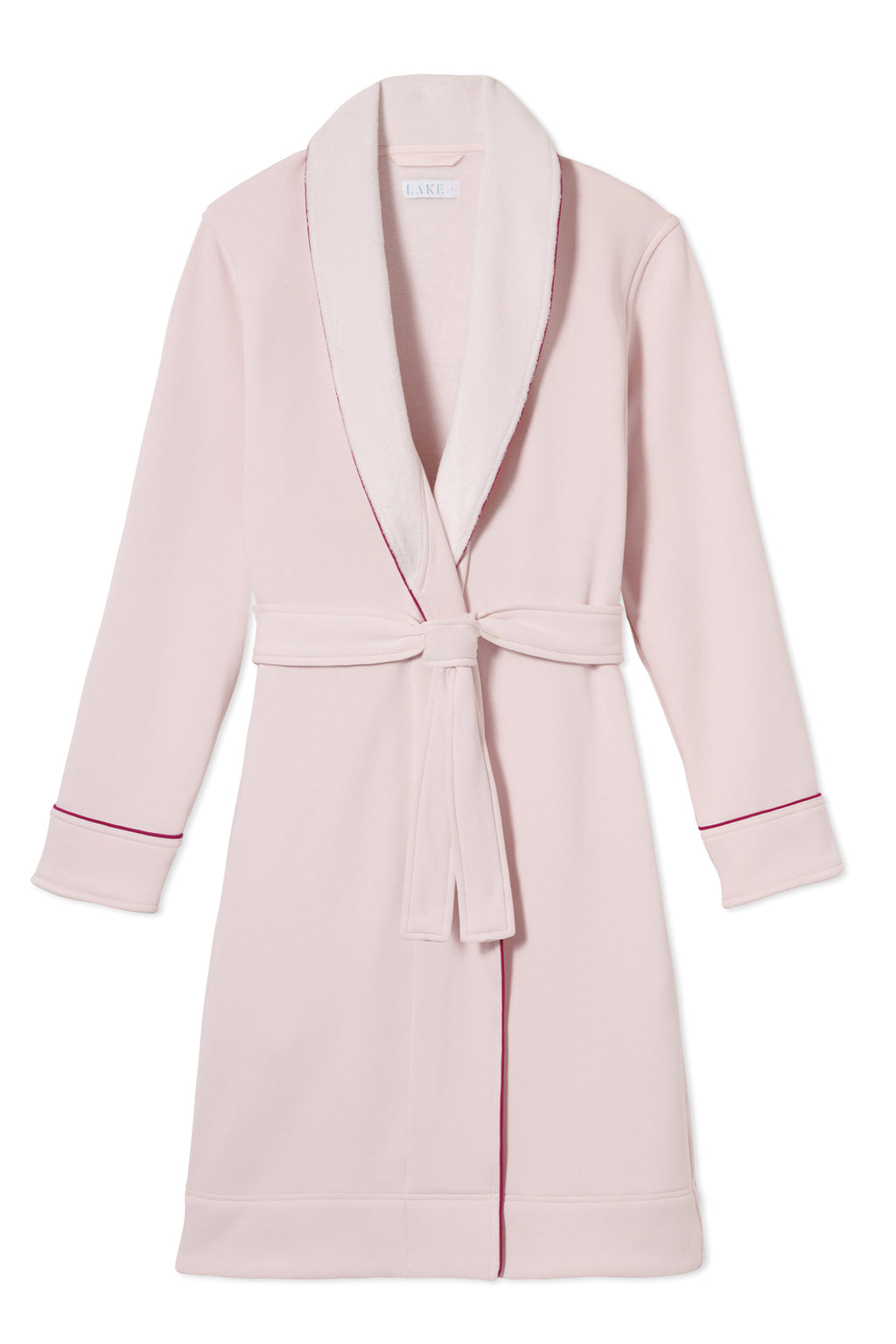 The Cozy Robe in Berry features a light pink cotton jersey exterior, shawl collar, matching belt, and dark pink piping on the cuffs and collar edges, shown laid flat on a white background.
